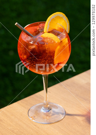 glass of aperol spritz cocktail 129978182