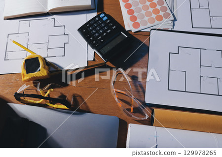 Closeup of team of industrial engineers meeting analyze machinery blueprints consult project on table in manufacturing factory. Working in manufacturing plant or production plant. 129978265