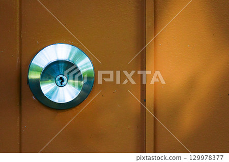 A scene with a door and a doorknob A scene with a door and a doorknob 129978377