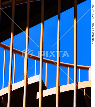 Spiral staircase and blue sky image 129978706