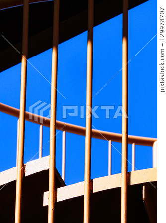 Spiral staircase and blue sky image 129978707