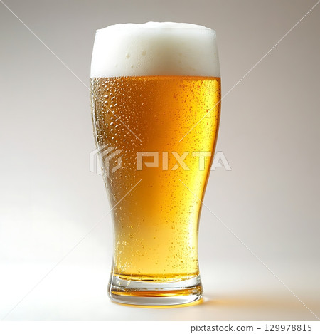 Cold Beer in a Glass with Foam 129978815