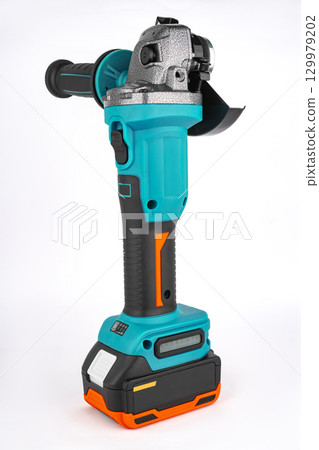 Convenient angle grinder with protective cover and battery. On a white background 129979202
