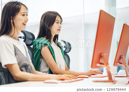 A young career woman working at a production company A young career woman working at a production company 129979444