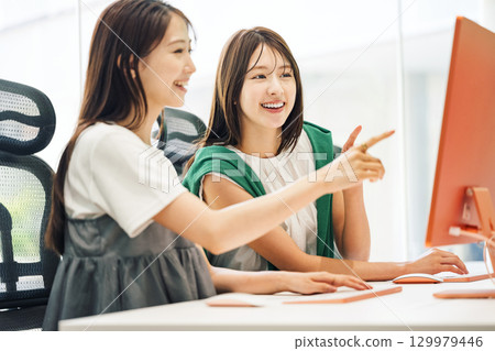 A young career woman working at a production company 129979446