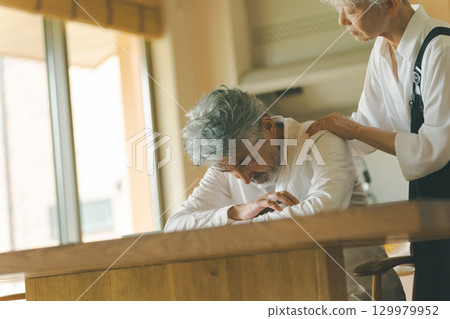 A depressed man in his 50s and the woman who supports him 129979952