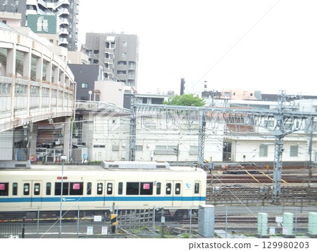 Overpass and train at Sagami-Ono Station 129980203