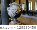 Marble Urn With Gilded Satyr Handle in Historic Palace Interior 129980450