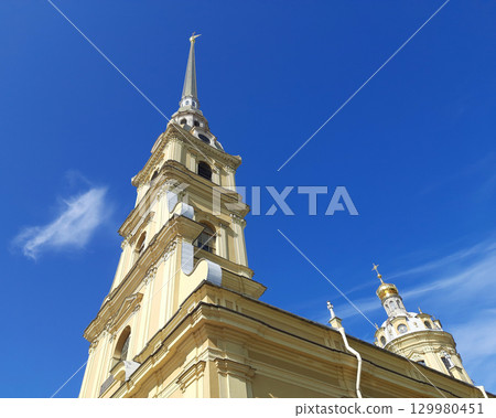 Baroque Church Bell Tower Under Clear Blue Sky Baroque Church Bell Tower Under Clear Blue Sky 129980451