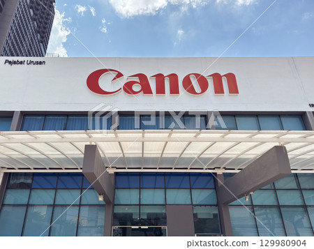 Canon building in Penang, Malaysia showcases modern architecture and branding on a clear day 129980904
