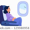 passenger sitting on chairs in plane cabin during air flight. 129980958