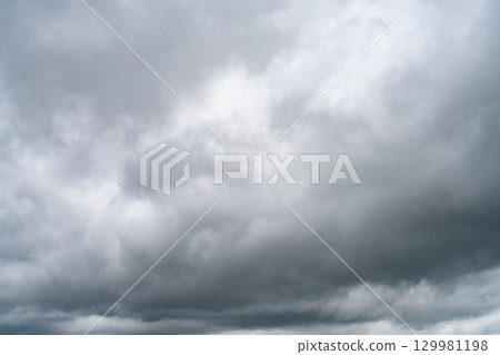 Dramatic overcast sky with gray and white clouds before rainy season storm, moody and gloomy weather background. Climate, meteorology, and atmospheric. Weather forecasting, climate change background. 129981198