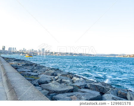 Bosphorus Panorama in Istanbul: Promenade, Sea, and City Silhouette Bosphorus Panorama in Istanbul: Promenade, Sea, and City Silhouette 129981578
