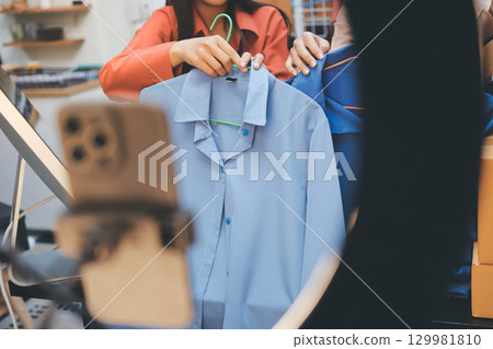 Portrait of Starting small businesses SME owners, two Asian woman check online orders Selling products working with boxs freelance work at home office, sme business online small medium enterprise 129981810