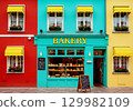 A colorful street corner with a bakery and gorgeous buildings 129982109