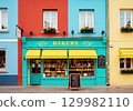 A colorful street corner with a bakery and gorgeous buildings 129982110
