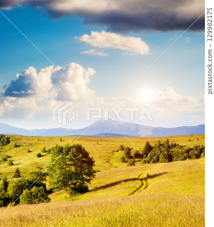sunny mountain landscape 129982175