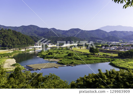 Beautiful scenery of the Hijikawa River and mountains seen from Ozu Castle Beautiful scenery of the Hijikawa River and mountains seen from Ozu Castle 129983909