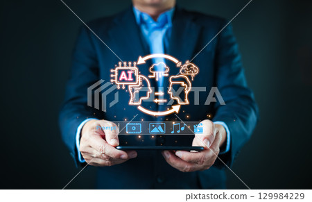 Engaging with an AI powered content creation interface, a businessman selects media options, highlighting the use of AI in research and digital innovation. 129984229