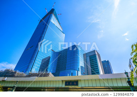 Tokyo cityscape, Japan, August 21st. Overlooking the redevelopment projects in Nihonbashi and Nihonbashi 1-chome. A new era... 129984870