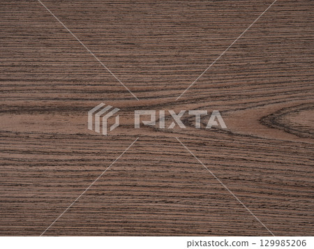 Flowing coppery swirls meander across this walnut veneer, evoking an organic symphony of color and texture 129985206