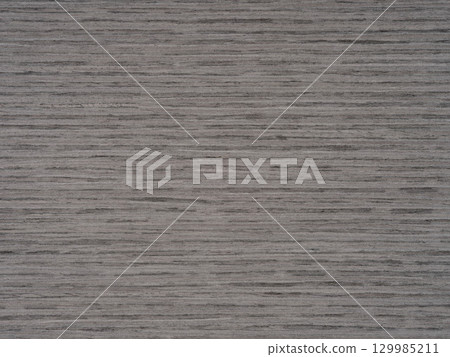 Steady grey tones ripple across the consistent grain of oak veneer 129985211