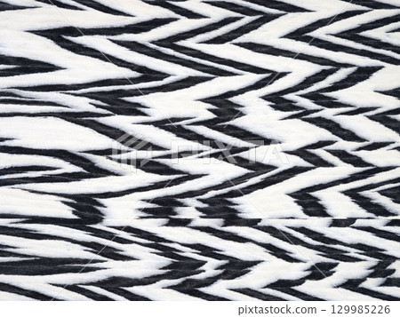 Monochromatic zebra pattern on a textured veneer surface with striking contrast 129985226