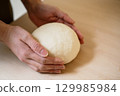 Handmade udon dough making 129985984