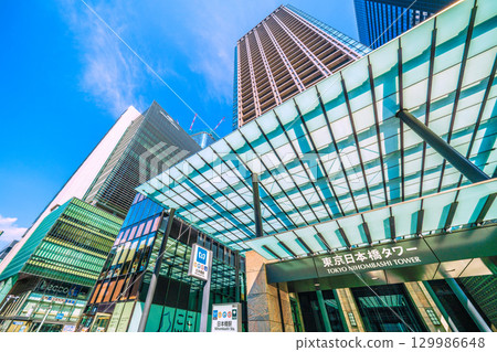 Tokyo cityscape, Japan, August 21. View of Nihonbashi Station (Exit B6) and Tokyo Nihonbashi Tower. Tokyo cityscape, Japan, August 21. View of Nihonbashi Station (Exit B6) and Tokyo Nihonbashi Tower. 129986648