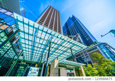 Tokyo cityscape, Japan, August 21. View of Nihonbashi Station (Exit B6) and Tokyo Nihonbashi Tower. Tokyo cityscape, Japan, August 21. View of Nihonbashi Station (Exit B6) and Tokyo Nihonbashi Tower. 129986675