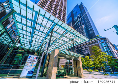 Tokyo cityscape, Japan, August 21. View of Nihonbashi Station (Exit B6) and Tokyo Nihonbashi Tower. Tokyo cityscape, Japan, August 21. View of Nihonbashi Station (Exit B6) and Tokyo Nihonbashi Tower. 129986754