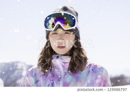 Cute woman in ski wear Cute woman in ski wear 129986797