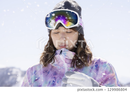 Cute woman in ski wear Cute woman in ski wear 129986804