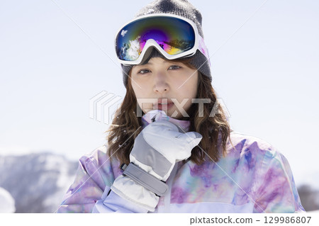 Cute woman in ski wear 129986807