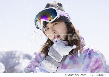 Cute woman in ski wear Cute woman in ski wear 129986808