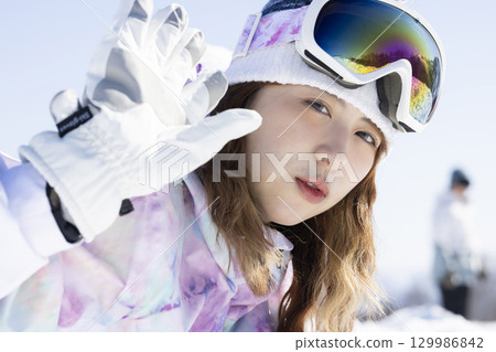 Cute woman in ski wear 129986842