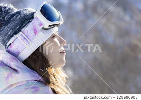 Cute woman in ski wear Cute woman in ski wear 129986905