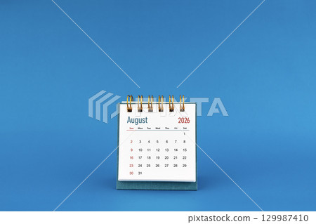 August 2026 mini desk calendar on blue color background. August 2026 mini desk calendar on blue color background. 129987410