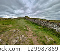 Hadrian's wall under a dramatic sky 129987869