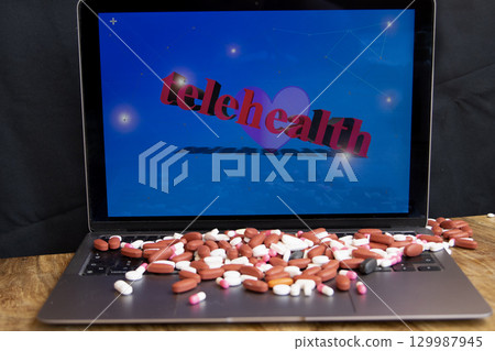 telehealth on laptop with pills telehealth on laptop with pills 129987945
