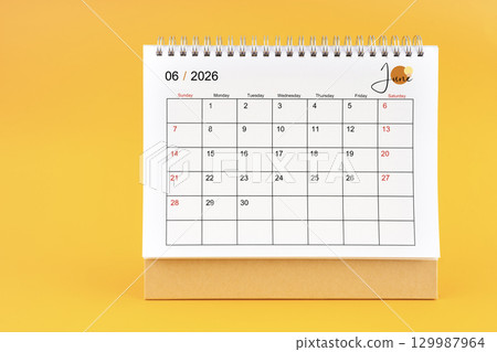 June 2026 Monthly desk calendar for 2026 year on yellow color background. 129987964