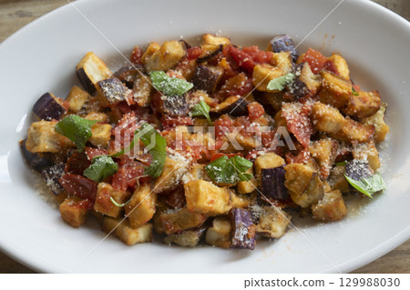 roasted eggplant salad with tomatoes parmesan cheese fresh basil mediterranean dish 129988030