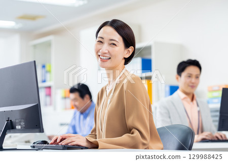 Middle business woman working in the office 129988425