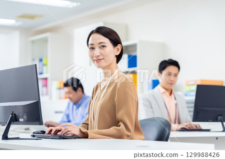 Middle business woman working in the office 129988426
