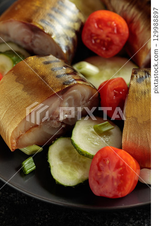 Smoked mackerel with fresh cucumbers, tomatoes and green onion. Smoked mackerel with fresh cucumbers, tomatoes and green onion. 129988897