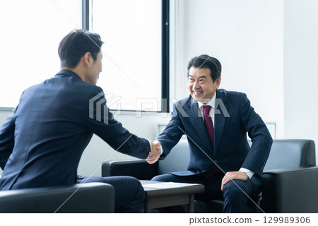 Businessman shaking hands Businessman shaking hands 129989306