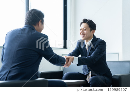 Businessman shaking hands Businessman shaking hands 129989307