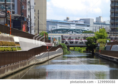 Tobu Kameido Line 10050 series train crossing the Kitajukken River (Koto Ward, Tokyo) 129990088