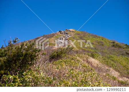 Climbing Mount Bandai in autumn 129990211