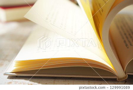 Autumn is the season for reading. Open a book (image) 129991089